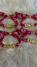 Load and play video in Gallery viewer, Custom Bandana Slider Bracelet with Gold Letters • College Game Day Spirit Jewelry
